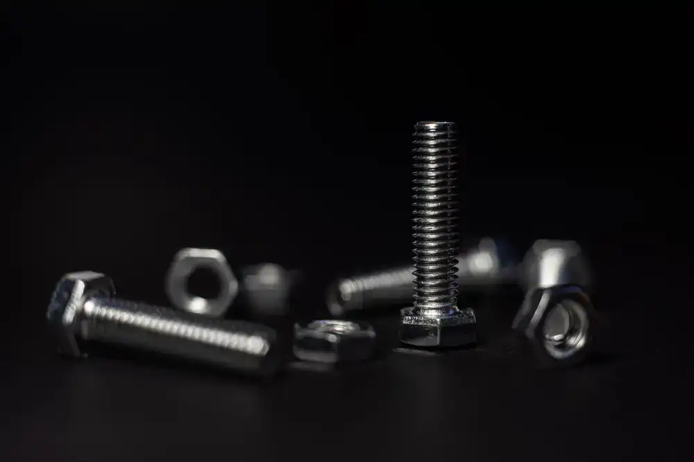 Various screws, bolts, and nails in bins
